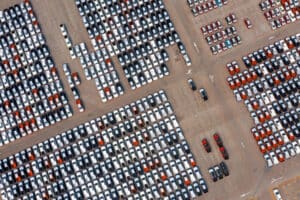Fenabrave-MT - aerial view of new cars at parking port in automobile factory